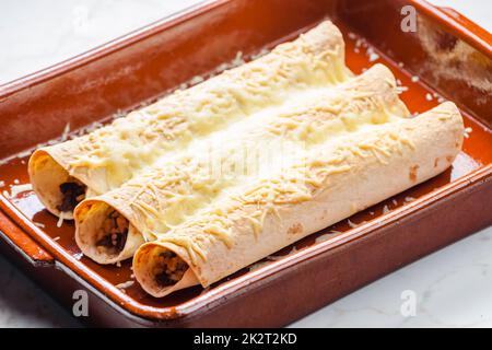 beef burritos in baking plate Stock Photo