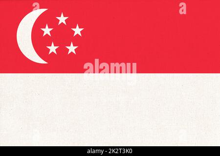 Flag of Singapore. Singaporean flag on fabric surface. Fabric Texture Stock Photo