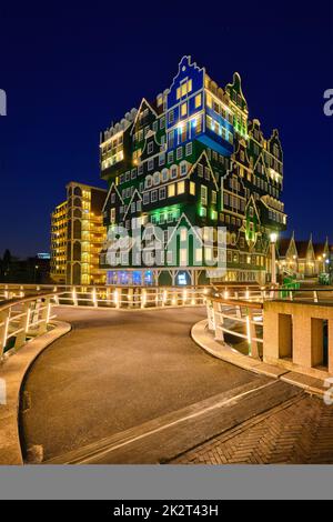 Inntel Hotel in Zaandam illuminated at night, Netherlands Stock Photo