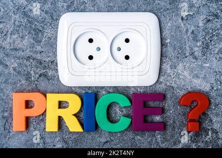 Double power European electric plug on the wall with a word PRICE Stock Photo