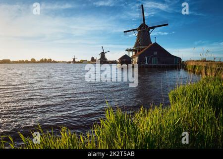 Windmills at Zaanse Schans in Holland on sunset. Zaandam, Nether Stock Photo