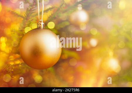 Christmas-tree decoration bauble on decorated Christmas tree bac Stock Photo