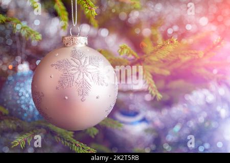 Christmas-tree decoration bauble on decorated Christmas tree bac Stock Photo