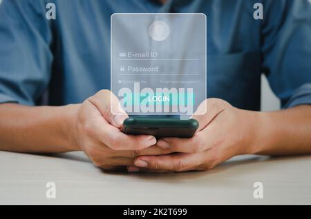 man using smartphone login password or email virtual screen concept technology. Stock Photo