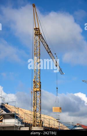 Crane working on construction site Stock Photo