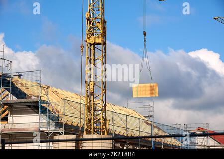Crane working on construction site Stock Photo