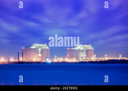 Liquified natural gas LNG tanks in port Stock Photo