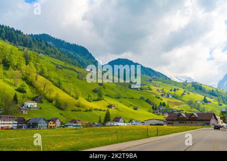 Countryside road in village, Alt Sankt Johann, Sankt Gallen, Swi Stock Photo