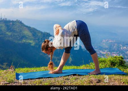 Woman doing Ashtanga Vinyasa yoga asana Utthita parsvakonasana - extended  side angle pose beginner variation isolated on white Stock Photo - Alamy