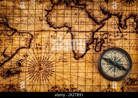 Old vintage compass on ancient map Stock Photo