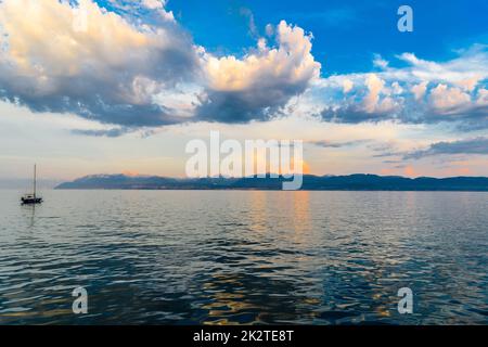 Sunset with reflections on beautiful Geneva lake, Switzerland Stock Photo