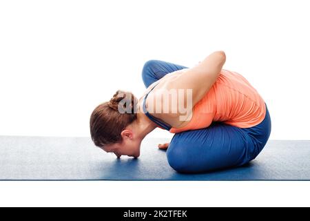 Woman doing Ashtanga Vinyasa Yoga asana Marichyasana B Stock Photo