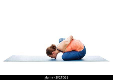 Woman doing Ashtanga Vinyasa Yoga asana Marichyasana B Stock Photo