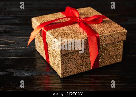 Gift box with red ribbon Stock Photo