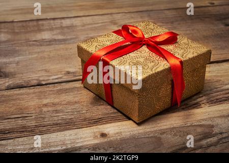 Gift box with red ribbon Stock Photo