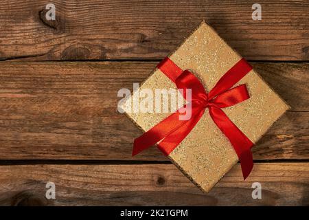 Gift box with red ribbon Stock Photo