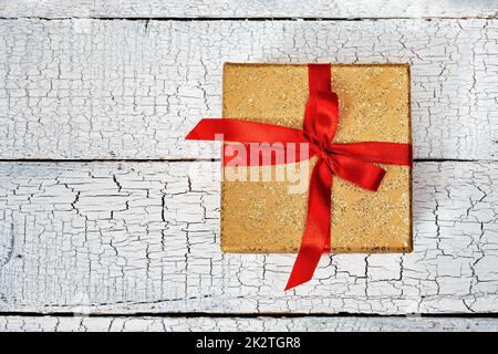 Gift box with red ribbon Stock Photo