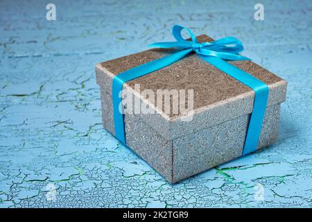 Gift box with blue ribbon Stock Photo