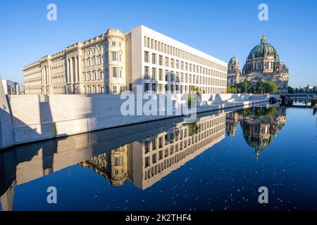 The rebuilt City Palace with the Berliner Dom reflected in the river Spree Stock Photo