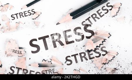 The word stress is standing on a paper, pen with eraser, burnout concept, work life balance, breakdown by exhaustion Stock Photo