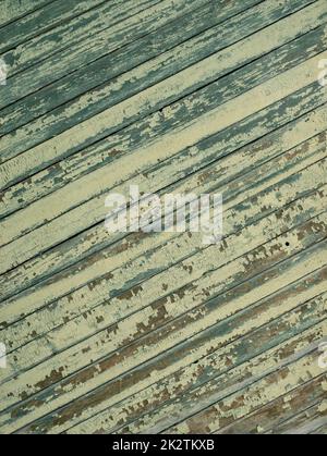 An old wooden diagonal plank wall brown and green Stock Photo