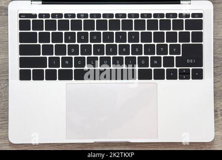 Keyboard with words diversity, equity, inclusion on table concept DEI Stock Photo