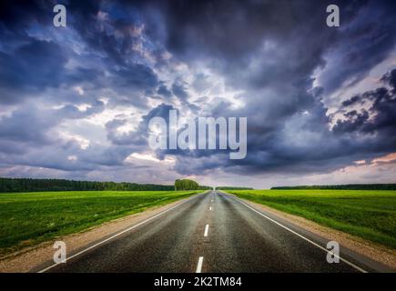 Road and stormy sky Stock Photo