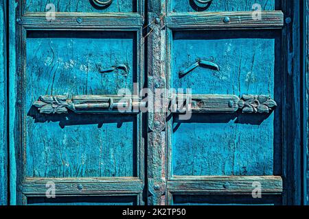 Latch with padlock on door in India Stock Photo