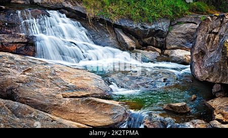 Small tropical waterfall Stock Photo