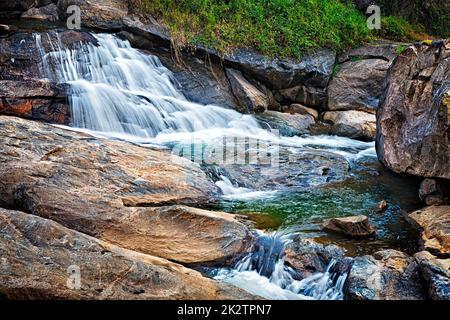 Small tropical waterfall Stock Photo