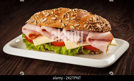 Ham sandwich on wooden background Stock Photo