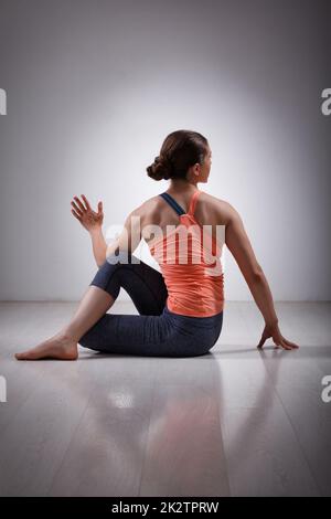 Sporty fit yogini woman practices yoga asana Stock Photo