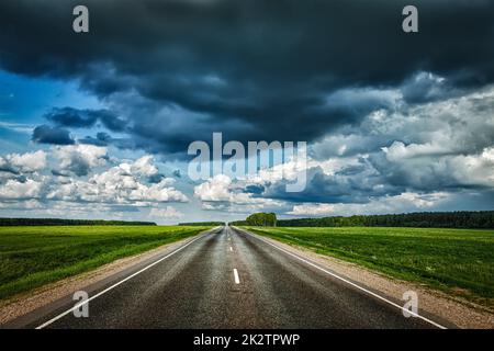 Road and stormy sky Stock Photo