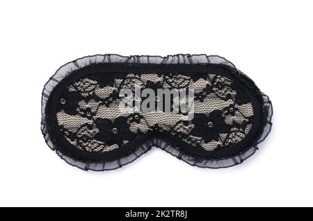 Lace black textile sleep mask on a white isolated background Stock Photo