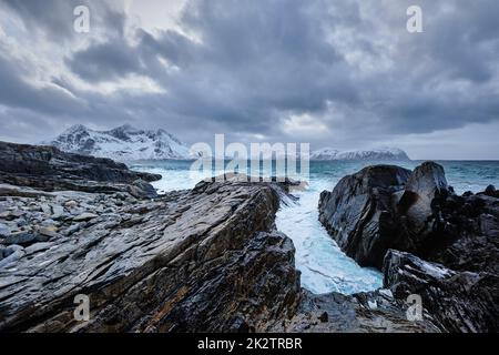 Norwegian Sea waves on rocky coast of Lofoten islands, Norway Stock Photo