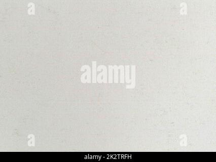 High quality close up aged paper texture background old yellowed, gray uncoated fine grain smooth bond paper with dust particles copy space for text for presentation wallpaper design mockup Stock Photo