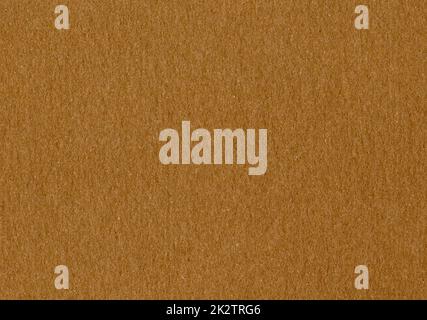 Highly detailed close up cardboard paper texture background fine grain caramel brown smooth uncoated corrugated fiberboard with copy space for text for material mockup or wallpaper Stock Photo