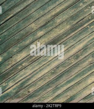 An old wooden diagonal plank wall brown and green Stock Photo