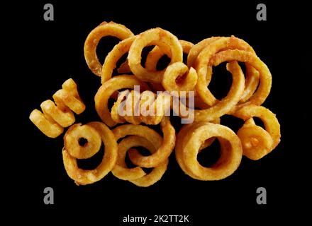Tasty curly fries on table Stock Photo