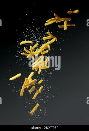 French fries on black background or surface Stock Photo