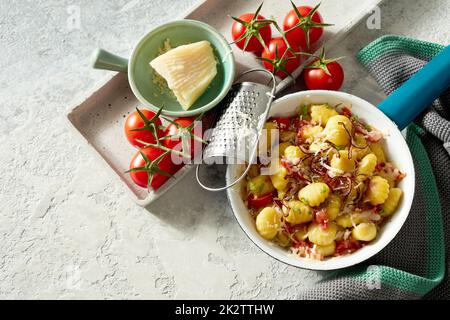 Palatable gnocchi in pan on table Stock Photo