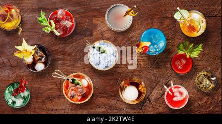 Tasty various alcohol cocktails on table Stock Photo