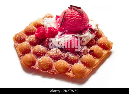 Yummy egg waffle with ice cream scoop and nuts Stock Photo - Alamy