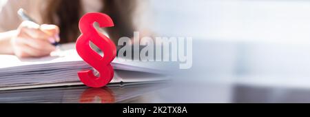 Close-up Of A Red Paragraph Symbol Stock Photo