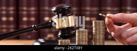 Close-up Of Human Hand Placing A Coin Stock Photo
