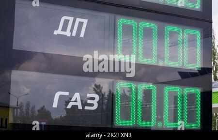 Display of gas stations with prices in Ukraine. Diesel fuel 00.00, gas 00.00. Translation: DP, GAZ. Shortage and lack of fuel and gas at filling stations. Stock Photo