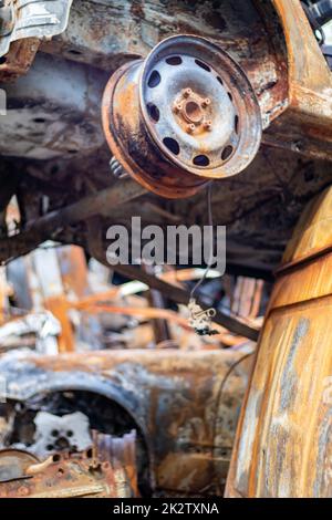 The car was completely destroyed by fire. Abandoned, burnt and rusty ...