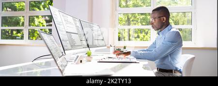 Software developer working in office Stock Photo