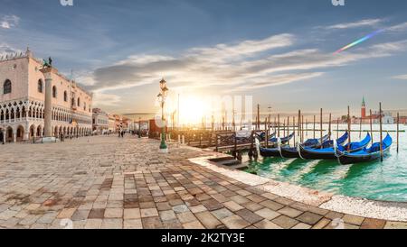 Doge's Palace and gondolas pier near San Marco Square at sunrise, Venice, Italy Stock Photo