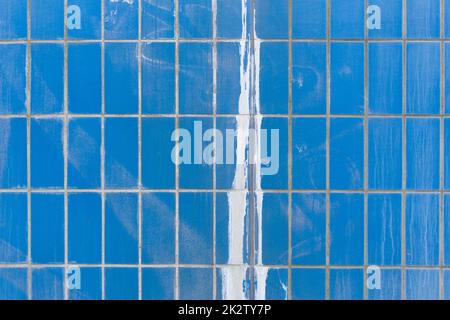 Blue ceramic tile wall with paint splash Stock Photo